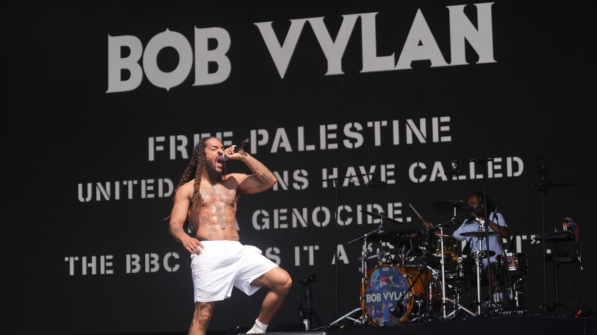 Rappers are suing a broadcaster for alleging that a singer encouraged ‘antisemitic chants’ during a performance at Glastonbury.